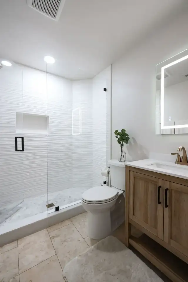 Bathroom remodel in Sorrento Valley, San Diego with wavy white tile shower and oak vanity